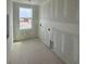 The utility room under construction features a window for natural light and utility connections at 710 Junonia Blvd, New Smyrna Beach, FL 32168
