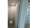 Toilet room with neutral finishes and a view of the glass shower at 710 Junonia Blvd, New Smyrna Beach, FL 32168