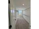 Large walk-in closet featuring carpet, wire shelving, and a window for natural light at 710 Junonia Blvd, New Smyrna Beach, FL 32168