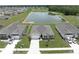 Aerial view of homes and community pond at 715 Auburn Grove Ct, Auburndale, FL 33823