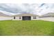 Expansive backyard with green grass, perfect for outdoor activities and entertaining at 715 Auburn Grove Ct, Auburndale, FL 33823