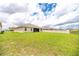 Large, grassy backyard offering plenty of space and a serene outdoor environment at 715 Auburn Grove Ct, Auburndale, FL 33823