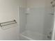 Bathroom featuring shower-tub combo with white tile surround at 715 Auburn Grove Ct, Auburndale, FL 33823