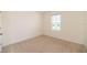 Bedroom featuring neutral carpet, base trim, and a window with blinds at 715 Auburn Grove Ct, Auburndale, FL 33823