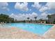 Beautiful community pool with brick pavers and lounge chairs, perfect for relaxation and socializing at 715 Auburn Grove Ct, Auburndale, FL 33823
