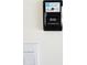 Garage interior featuring a smart Chamberlain garage door system with remote access app at 715 Auburn Grove Ct, Auburndale, FL 33823