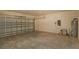 Large open garage offering ample space for parking and storage at 715 Auburn Grove Ct, Auburndale, FL 33823