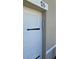Garage door featuring a digital keypad for keyless entry at 715 Auburn Grove Ct, Auburndale, FL 33823
