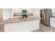Spacious kitchen featuring a center island and stainless steel refrigerator at 715 Auburn Grove Ct, Auburndale, FL 33823