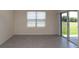 Bright living area with tile floors, sliding glass doors and lots of natural light at 715 Auburn Grove Ct, Auburndale, FL 33823