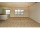 Open-concept living area with carpet floors and abundant natural light at 715 Auburn Grove Ct, Auburndale, FL 33823