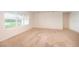 Spacious living room with carpet flooring, windows, and natural light at 715 Auburn Grove Ct, Auburndale, FL 33823