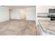 Open concept living area with carpet floors and kitchen with granite countertops at 715 Auburn Grove Ct, Auburndale, FL 33823