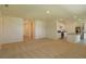 Open concept living space with carpet flooring and abundant natural light at 715 Auburn Grove Ct, Auburndale, FL 33823