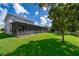 Spacious backyard with screened-in porch offers a great outdoor living space at 7263 Winding Lake Cir, Oviedo, FL 32765