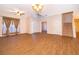 Spacious foyer with wood-look floors, staircase, chandelier, and high ceilings providing a grand entrance at 7263 Winding Lake Cir, Oviedo, FL 32765