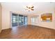 Open-concept living area with tile flooring, seamlessly connecting to the kitchen and screened-in lanai at 7263 Winding Lake Cir, Oviedo, FL 32765