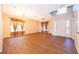 Bright living room featuring tile floors, high ceilings, and large windows with decorative curtains at 7263 Winding Lake Cir, Oviedo, FL 32765