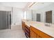Main bathroom with a double sink vanity, soaking tub, and glass-enclosed shower at 7263 Winding Lake Cir, Oviedo, FL 32765