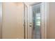 Tiled shower with a glass door and a door to the outside patio at 7263 Winding Lake Cir, Oviedo, FL 32765