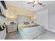 Tastefully decorated bedroom showcasing modern decor, neutral tones, and soft carpeting at 7521 Marker Ave, Kissimmee, FL 34747