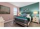 Cozy bedroom featuring an iron bed frame, soft carpet, and a neutral color palette at 7521 Marker Ave, Kissimmee, FL 34747