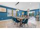 Bright dining area leading to the living room with a sliding door to the pool area at 7521 Marker Ave, Kissimmee, FL 34747