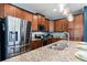 Modern kitchen with stainless steel appliances, granite countertops, and ample cabinet space at 7521 Marker Ave, Kissimmee, FL 34747