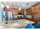 Modern kitchen with stainless steel appliances, granite countertops, and stylish pendant lights at 7521 Marker Ave, Kissimmee, FL 34747