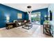 Cozy living room with modern decor, stylish lighting, and access to the pool area at 7521 Marker Ave, Kissimmee, FL 34747