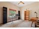 Study featuring a large window and plenty of room for storage; perfect for working from home at 8554 Amber Oak Dr, Orlando, FL 32817