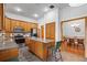 Well-lit kitchen features an island, stainless steel appliances, and wood cabinetry at 8554 Amber Oak Dr, Orlando, FL 32817