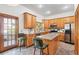 Well-lit kitchen featuring ample cabinet space, granite countertops, and modern appliances at 8554 Amber Oak Dr, Orlando, FL 32817