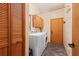 A well-equipped laundry room features a washer, dryer, cabinets, and convenient storage at 8554 Amber Oak Dr, Orlando, FL 32817
