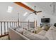 Lofted living room featuring skylights, neutral furniture, and a cozy atmosphere at 8554 Amber Oak Dr, Orlando, FL 32817