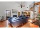 Bright living room with a spiral staircase, fireplace, and a comfortable sofa set at 8554 Amber Oak Dr, Orlando, FL 32817