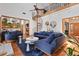 Bright living room with spiral staircase, fireplace, hardwood floors, and comfortable seating at 8554 Amber Oak Dr, Orlando, FL 32817