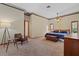 Large primary bedroom suite with carpet, two windows, and a ceiling fan at 8554 Amber Oak Dr, Orlando, FL 32817