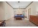 Primary bedroom with a ceiling fan, carpet, windows, and furniture set at 8554 Amber Oak Dr, Orlando, FL 32817