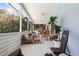 Spacious screened-in patio features comfortable seating and views of the backyard at 8554 Amber Oak Dr, Orlando, FL 32817