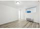 Clean and neutral bedroom with neutral walls, wood-look flooring, and a comfortable space at 935 S Atlantic Ave # 302, Daytona Beach, FL 32118