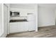 Modern kitchen with white cabinets, gray countertop, stainless steel microwave, and new appliances at 935 S Atlantic Ave # 302, Daytona Beach, FL 32118