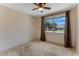 Bright carpeted bedroom with a large window and neutral decor at 944 Essex Rd, Daytona Beach, FL 32117