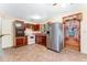 Functional kitchen features stainless steel refrigerator and white appliances at 944 Essex Rd, Daytona Beach, FL 32117