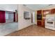 Open kitchen overlooking the carpeted living room area with eat-in bar at 944 Essex Rd, Daytona Beach, FL 32117