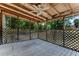 Spacious screened porch with wood ceiling and lattice style screening at 944 Essex Rd, Daytona Beach, FL 32117