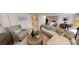 Comfortable living room with plush seating, perfect for relaxing and entertaining guests at 103 Orchid Ct, Poinciana, FL 34759