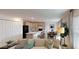 Open-concept living room with a view of the kitchen and dining area, creating a spacious and inviting atmosphere at 103 Orchid Ct, Poinciana, FL 34759