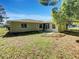 Private backyard offers green space and mature trees, ideal for outdoor enjoyment at 10350 Sw 62Nd Terrace Rd, Ocala, FL 34476