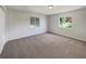 Spacious bedroom with windows overlooking the backyard at 10350 Sw 62Nd Terrace Rd, Ocala, FL 34476